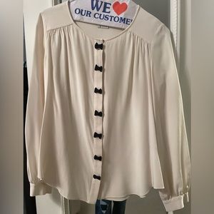 Kate Spade cream silk blouse with black bow-tie details, size S